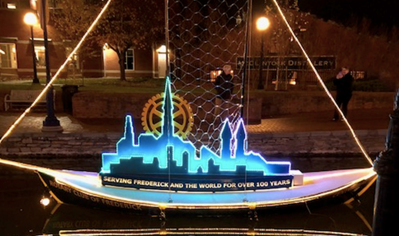 illuminated wooden rotary club of frederick boat in carroll creek
